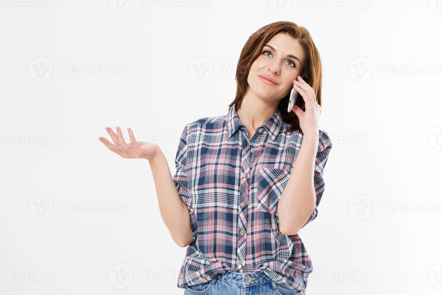 Brunette woman talking on smartphone over isolated background pointing with fingers on copy space, hand sign. photo