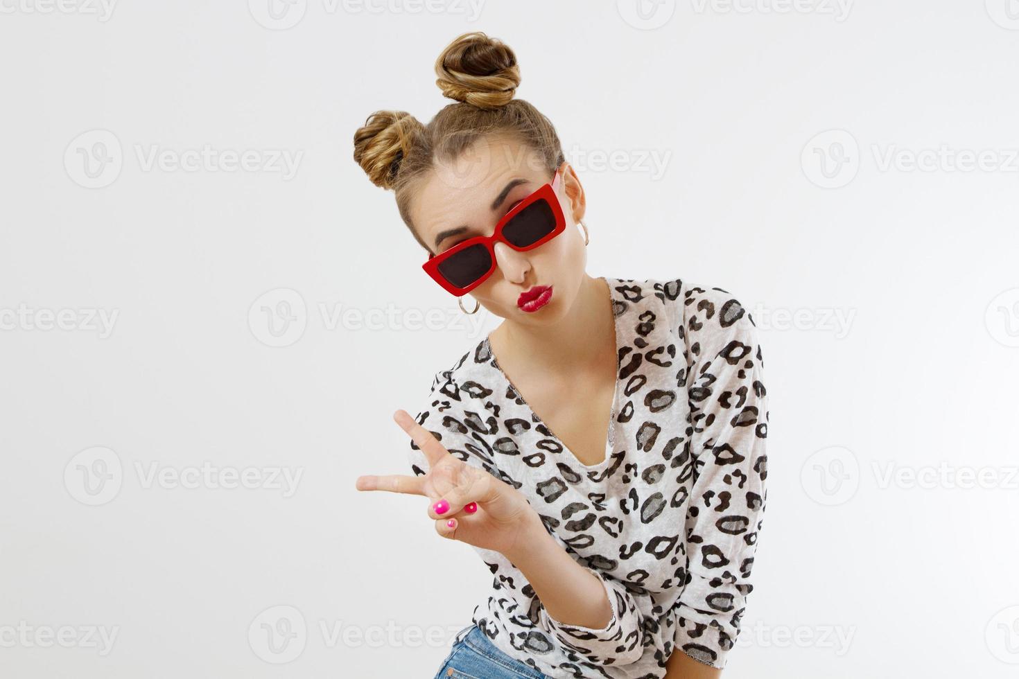 Close-up woman face. Fashion female closeup in trendy clothes isolated on white background. Summer fun time and summertime accessories. Funny girl. photo