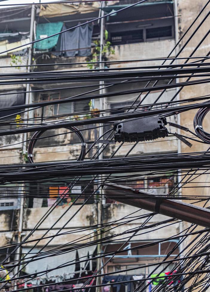 Absolute cable chaos on Thai power pole in Bangkok Thailand. photo