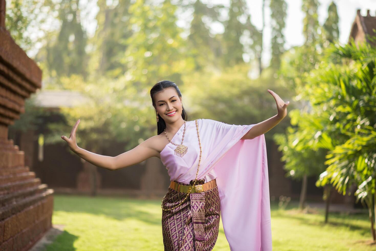 Beautiful Woman wearing typical Thai dress photo