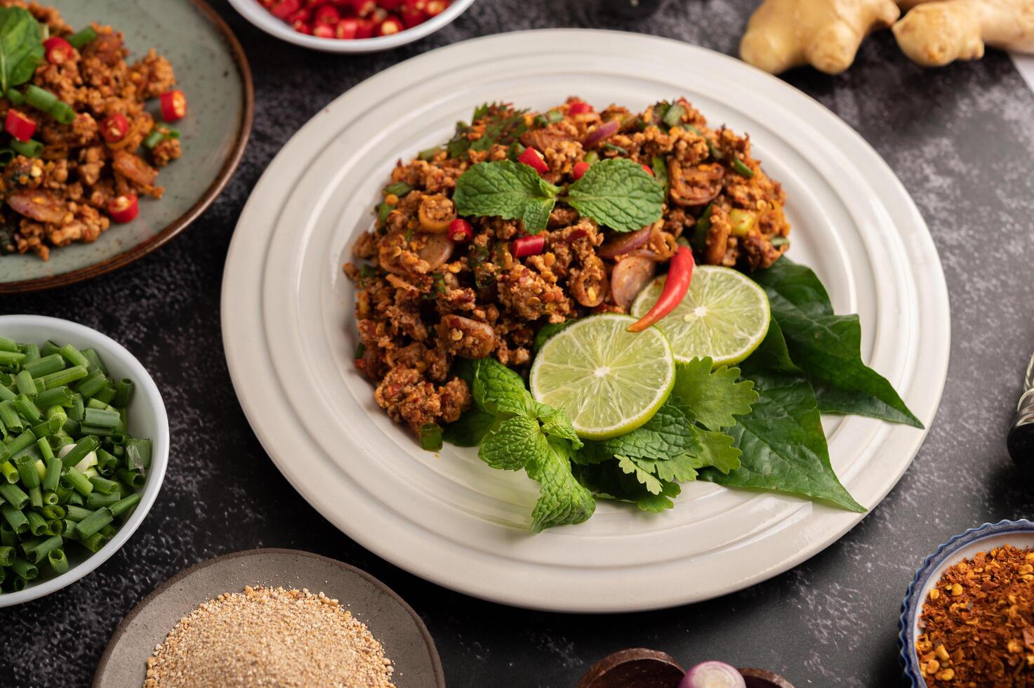 Spicy minced pork salad with chili flakes, lime, chopped green onions