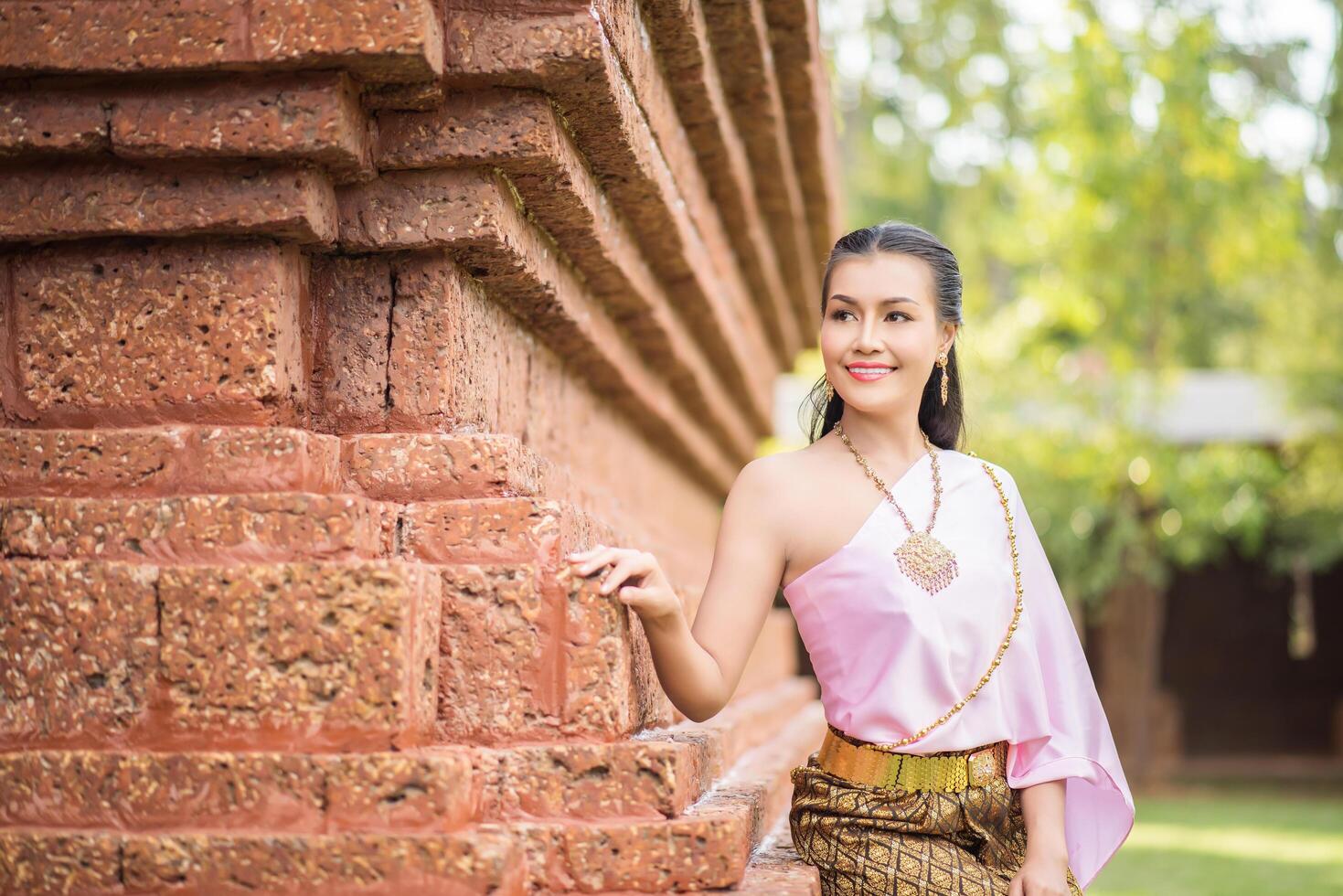 Beautiful Woman wearing typical Thai dress photo