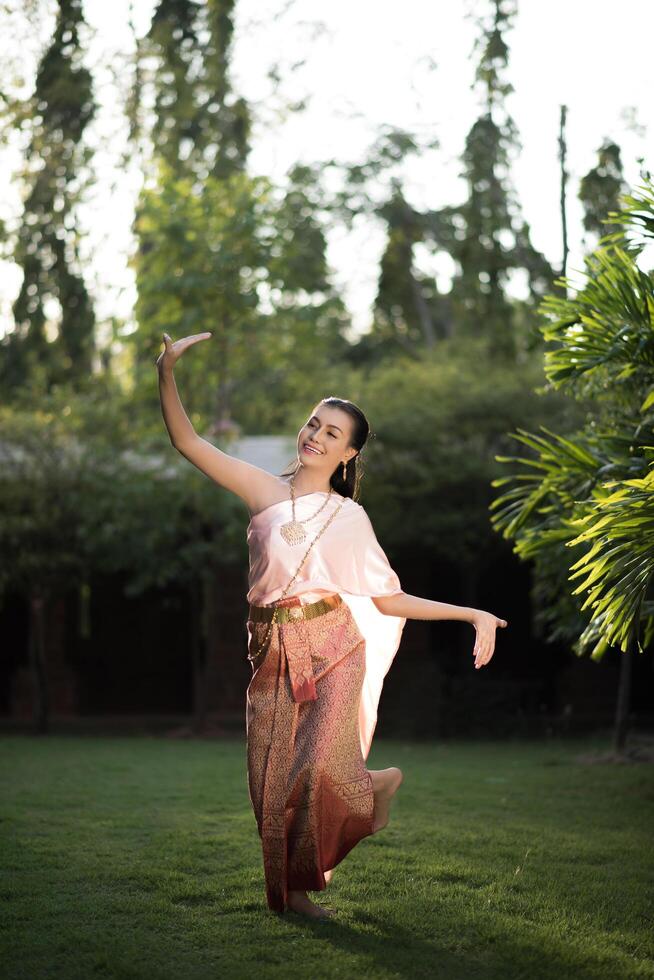 Beautiful Woman wearing typical Thai dress photo