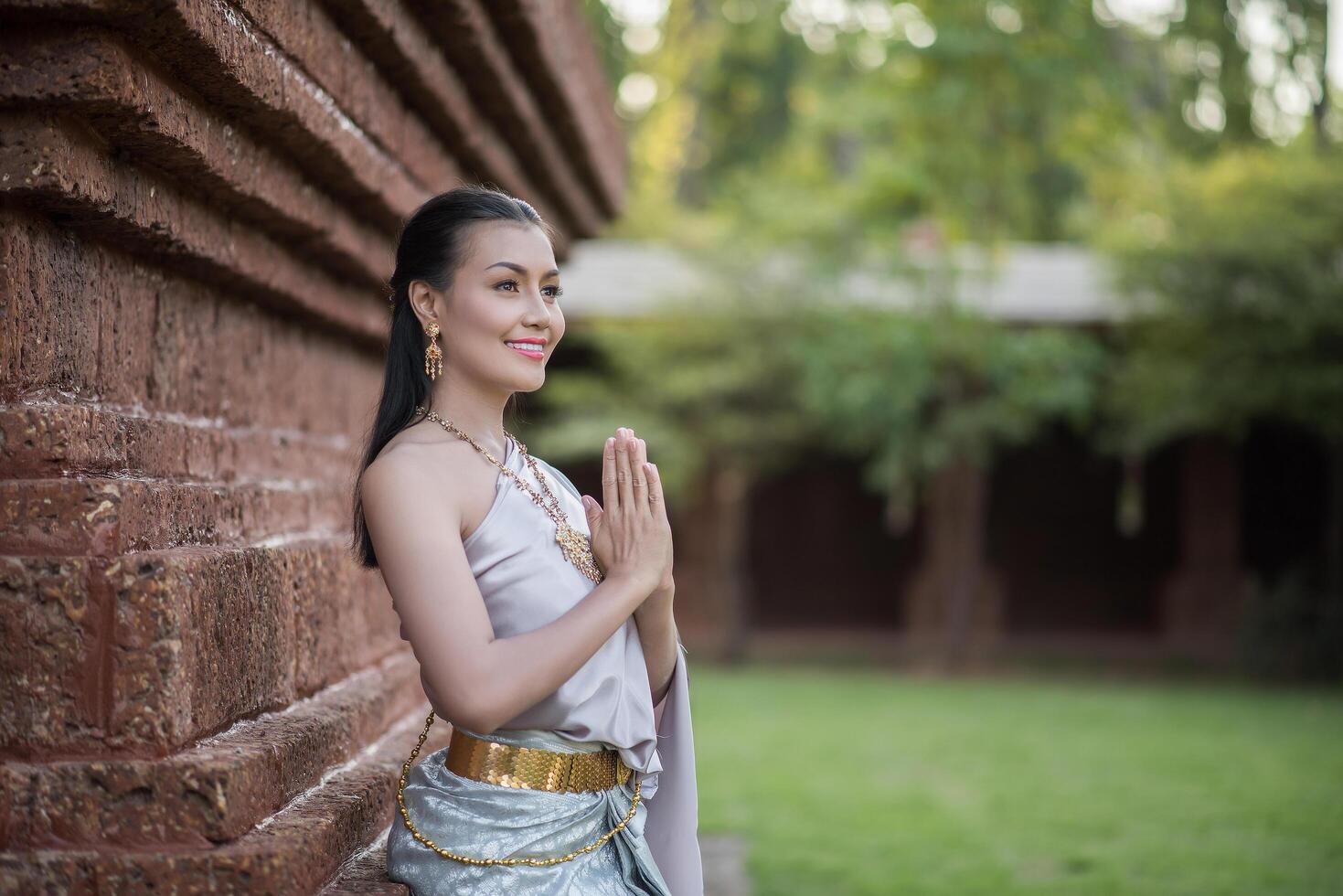 Beautiful Woman wearing typical Thai dress photo