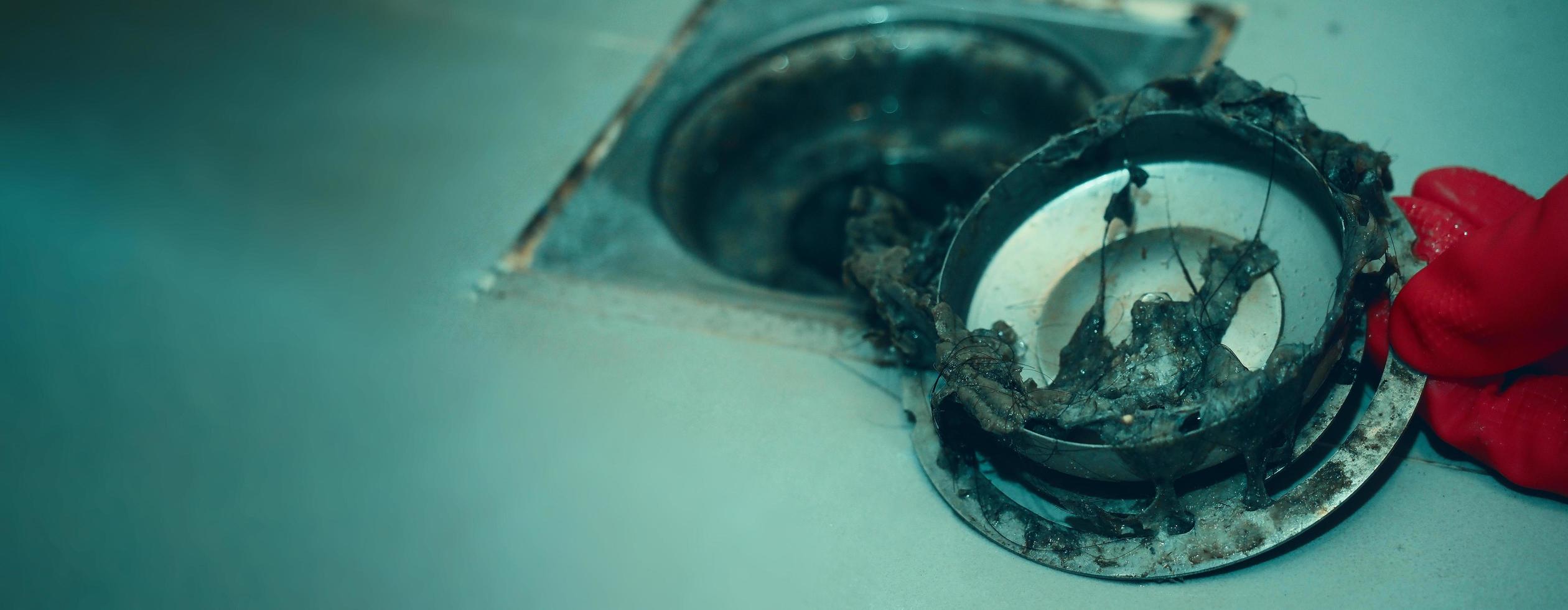 Drain cleaning. Clogged and dirty sewer pipes floor drain. photo