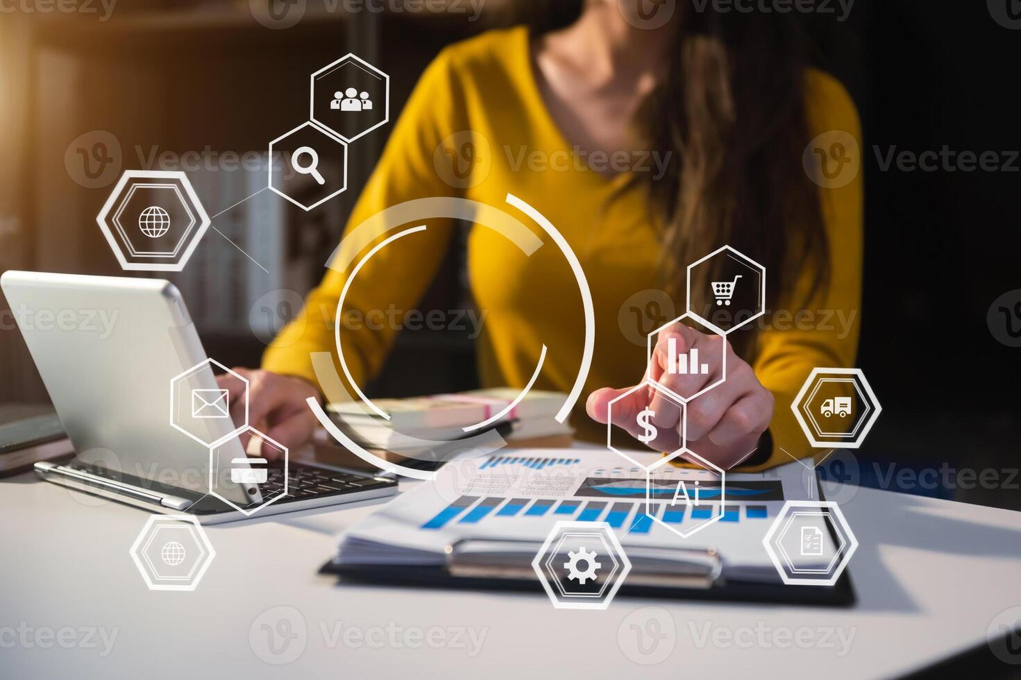 Businesswoman using mobile phone and laptop computer on white desk big data analytics photo