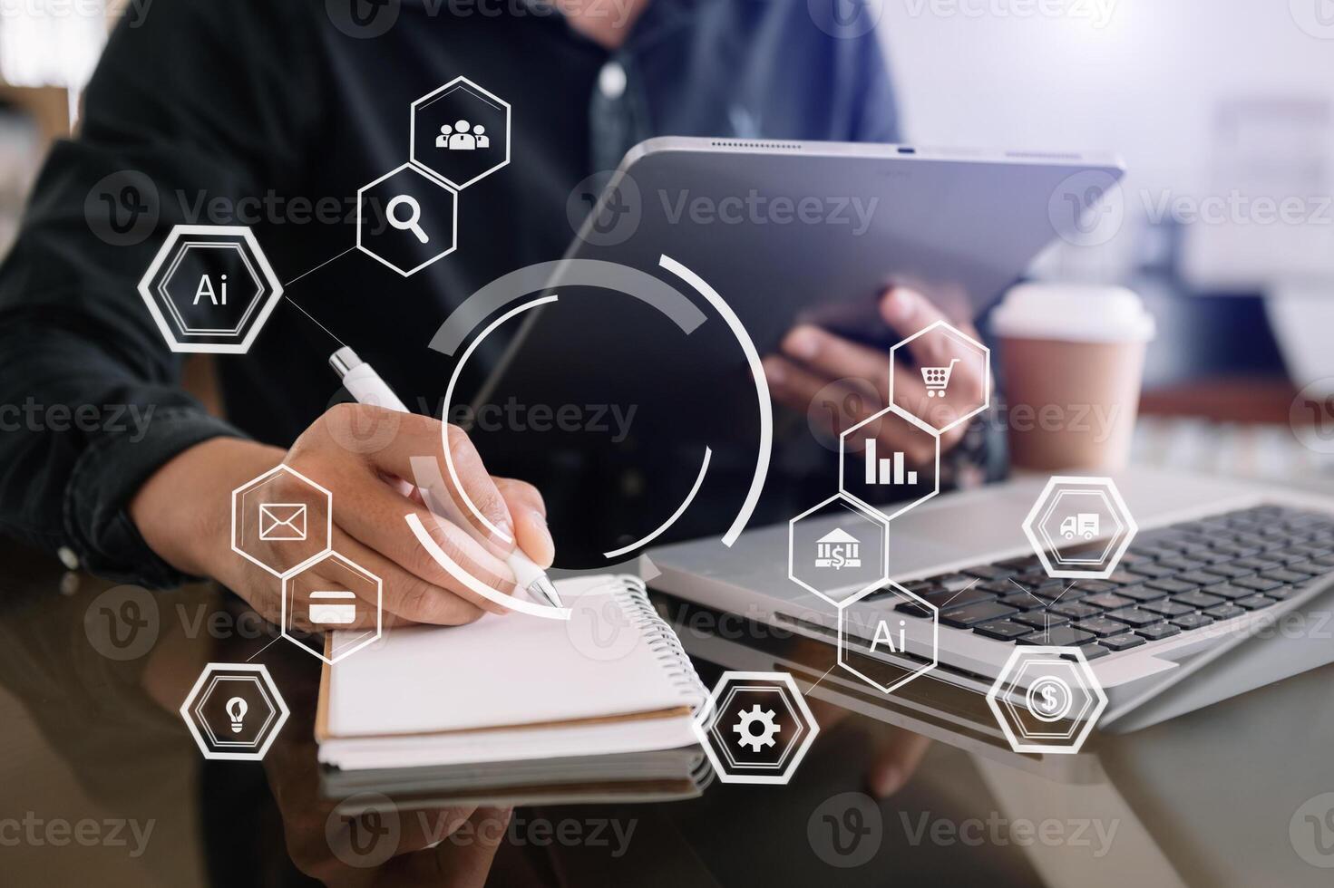 Businessman using mobile phone and laptop computer with business intelligence concept. photo