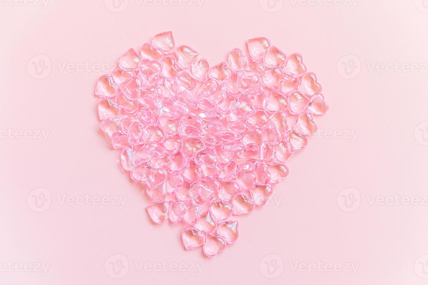 St. Valentine's Day concept. Heart shaped objects many pink hearts isolated on pink pastel background. Postcard banner on valentines day. Love date lovesick wedding romance symbol. Top view, flat lay photo