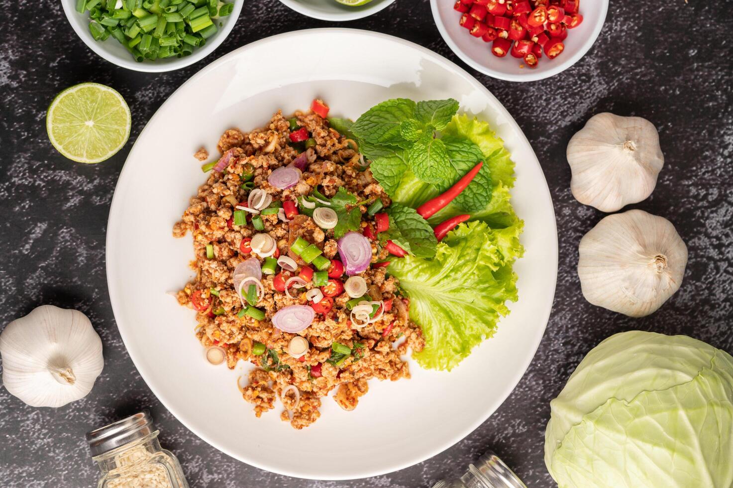 Spicy minced pork salad with chili flakes, lime, chopped green onions