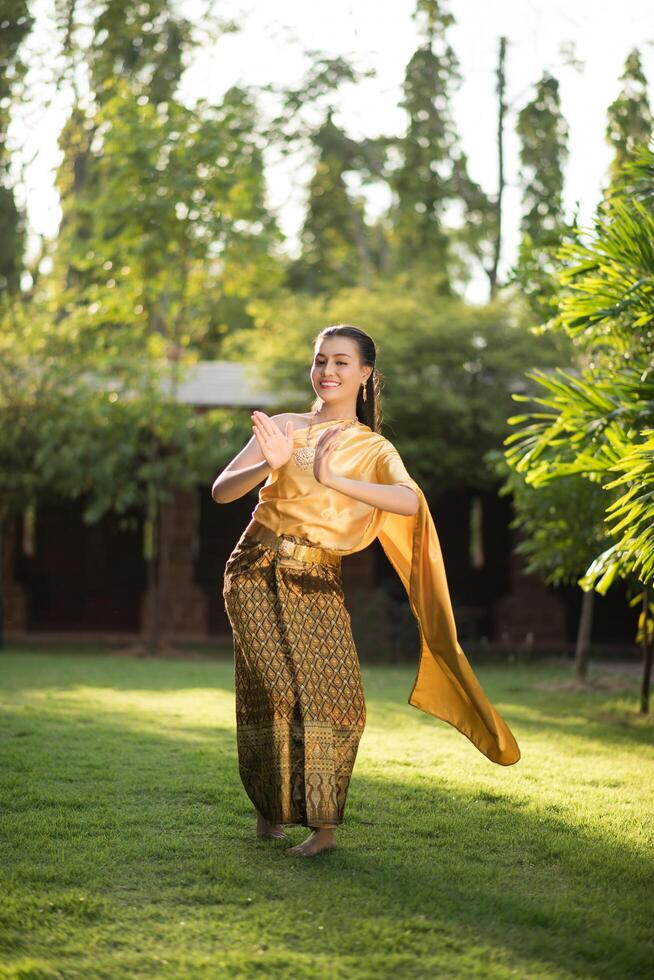 Beautiful Woman wearing typical Thai dress photo