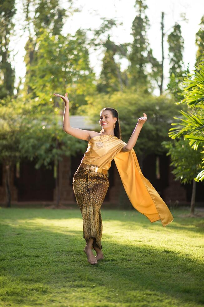 Beautiful Woman wearing typical Thai dress photo