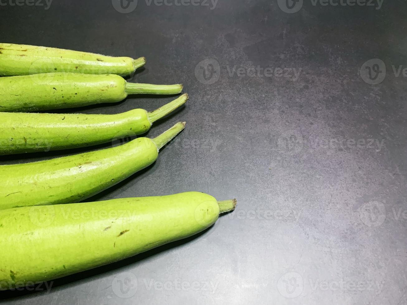 bottle gourd, Lagenaria siceraria isolated on black background. photo