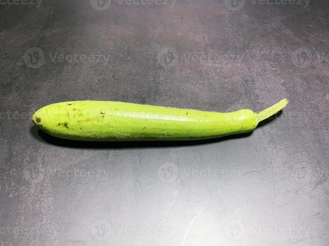 bottle gourd, Lagenaria siceraria isolated on black background. photo