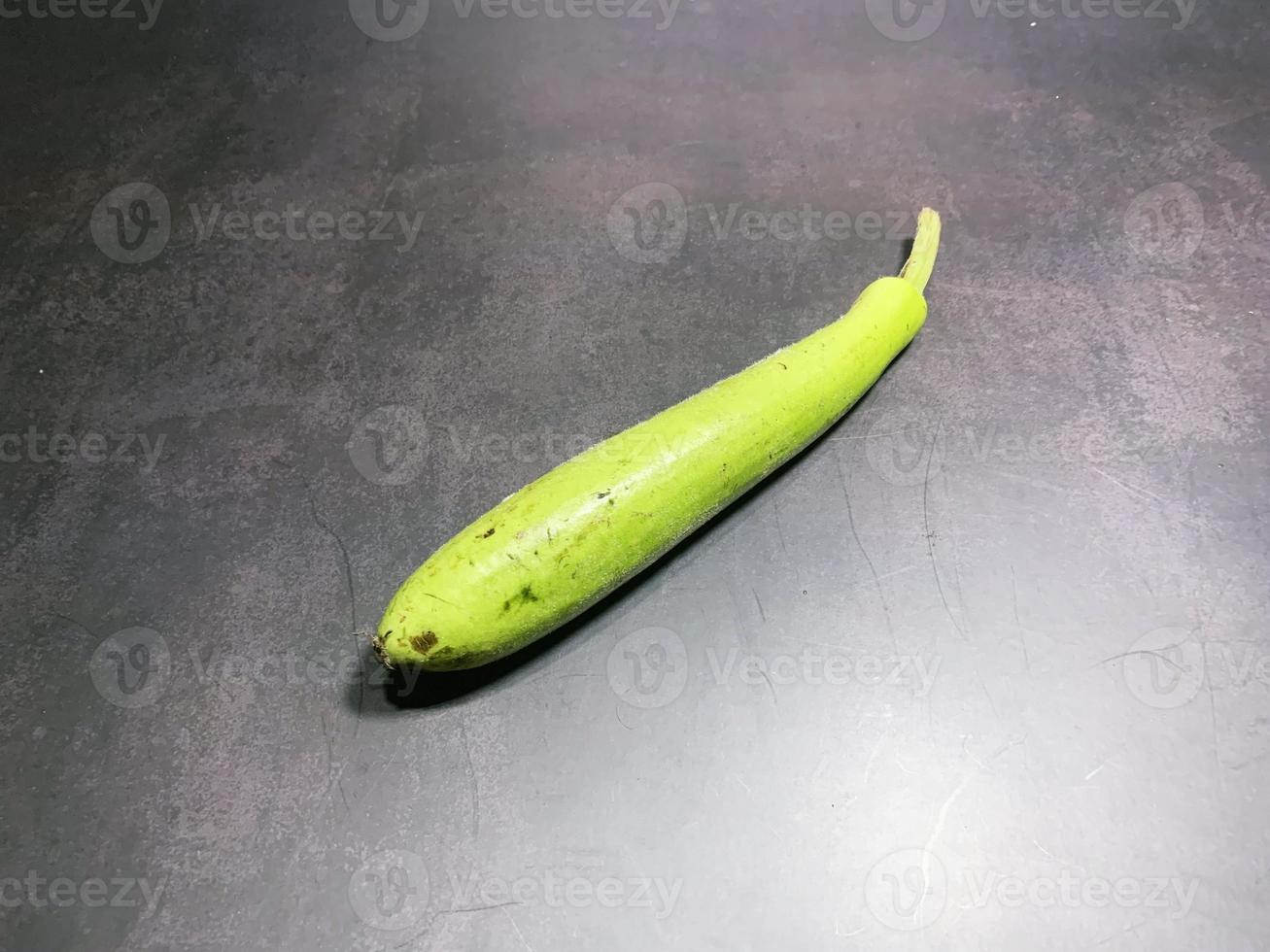 bottle gourd, Lagenaria siceraria isolated on black background. photo