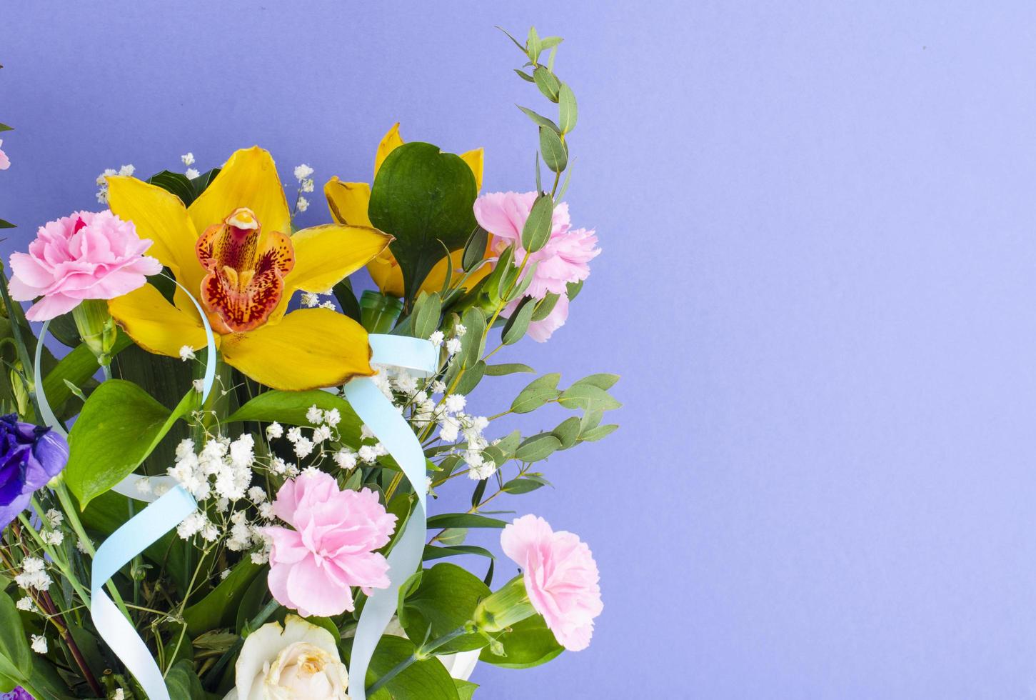 Bouquet of flowers on bright background. photo