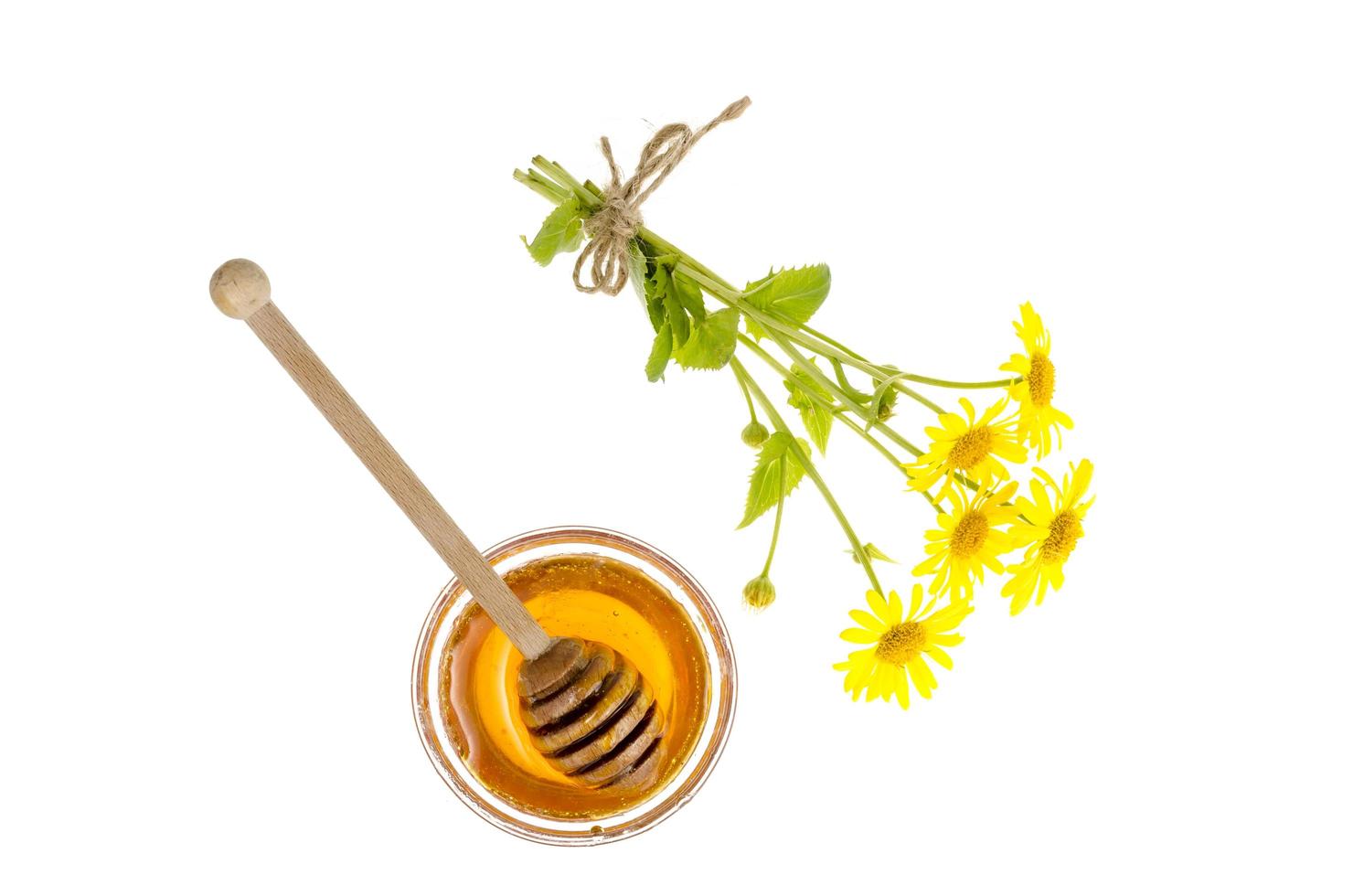 Transparent sweet flower honey in glass form. photo