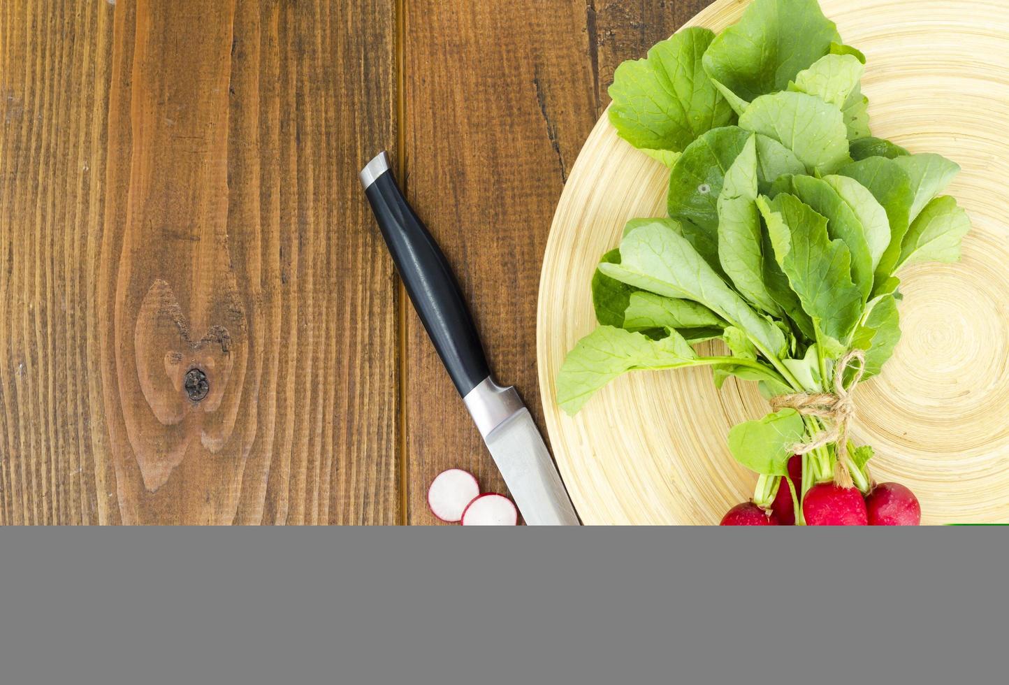 Fresh farmer bio radish on wooden plate. photo