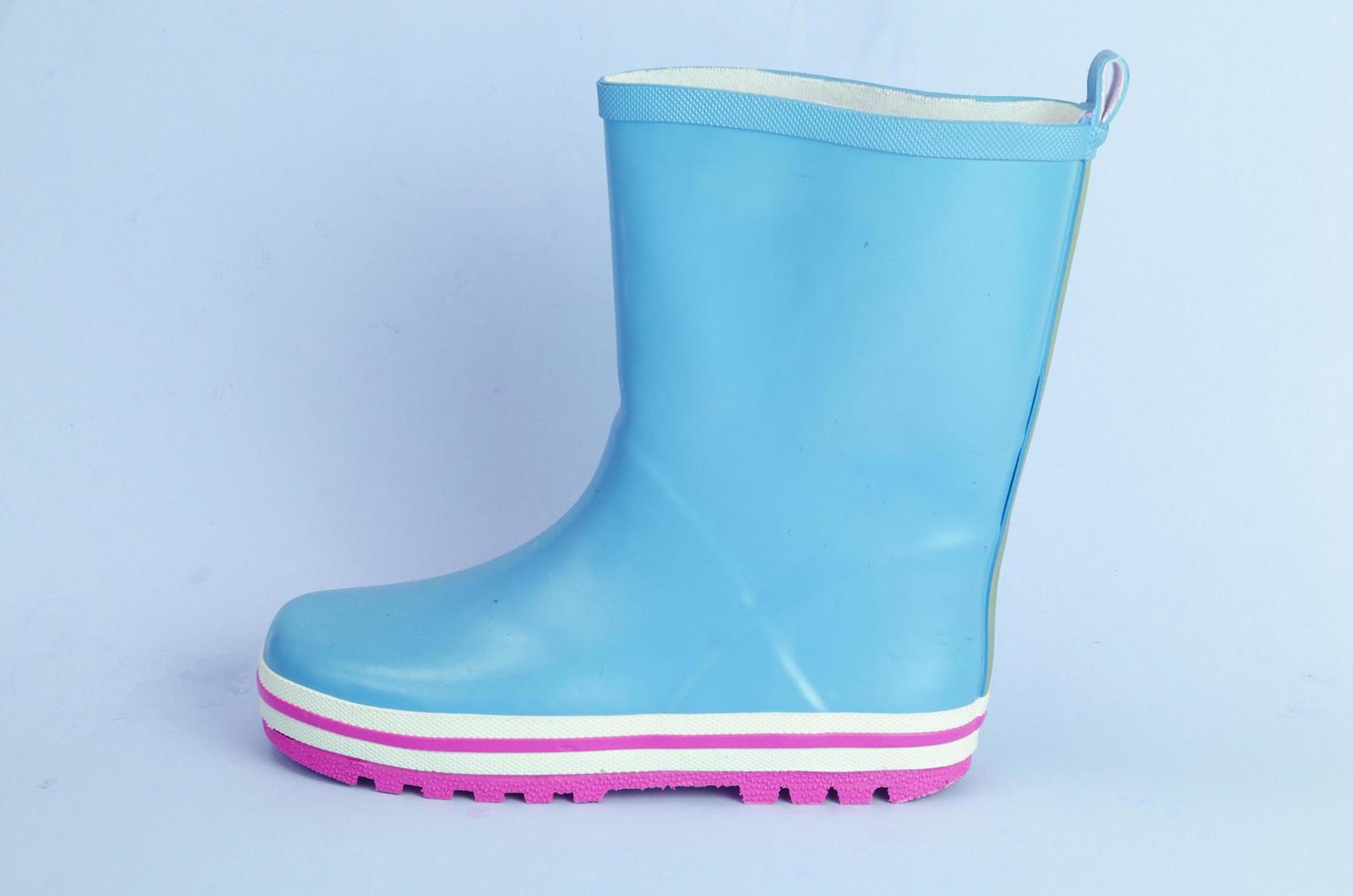 Children's pink rubber boots for walking. photo
