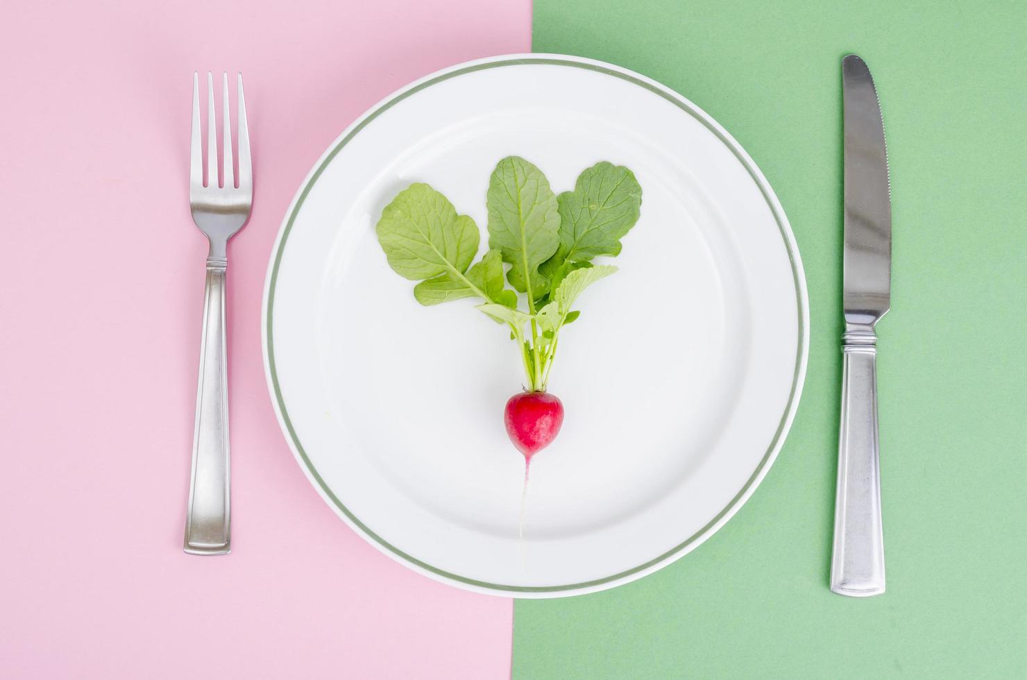 Red radish on plate. Vegetarian food concept, layout, menu. photo