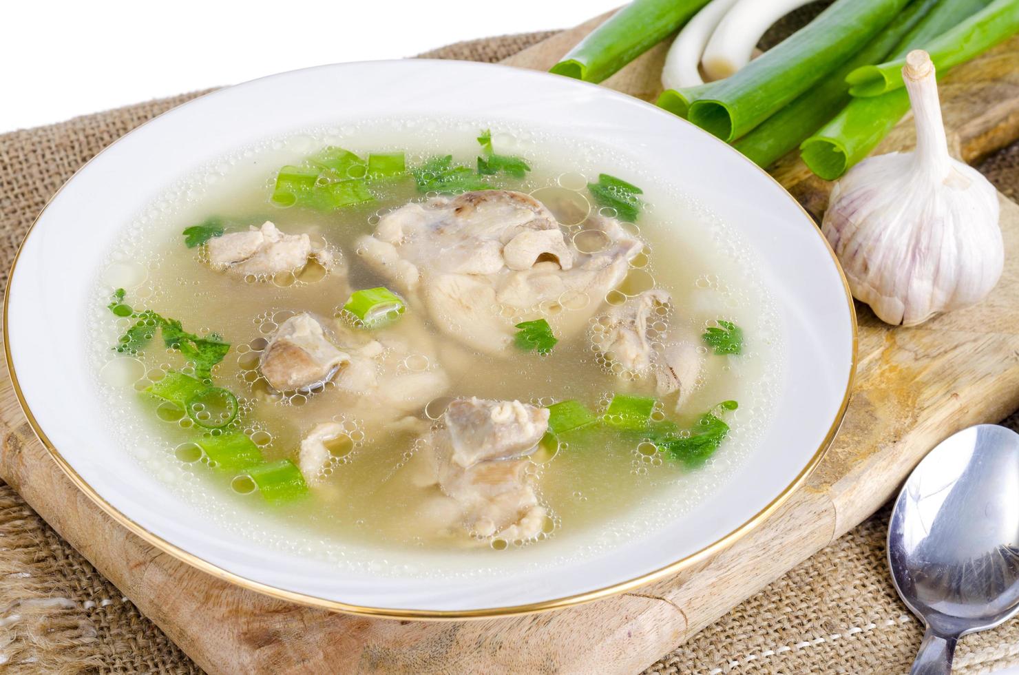 Broth with chicken meat Isolated on White background photo