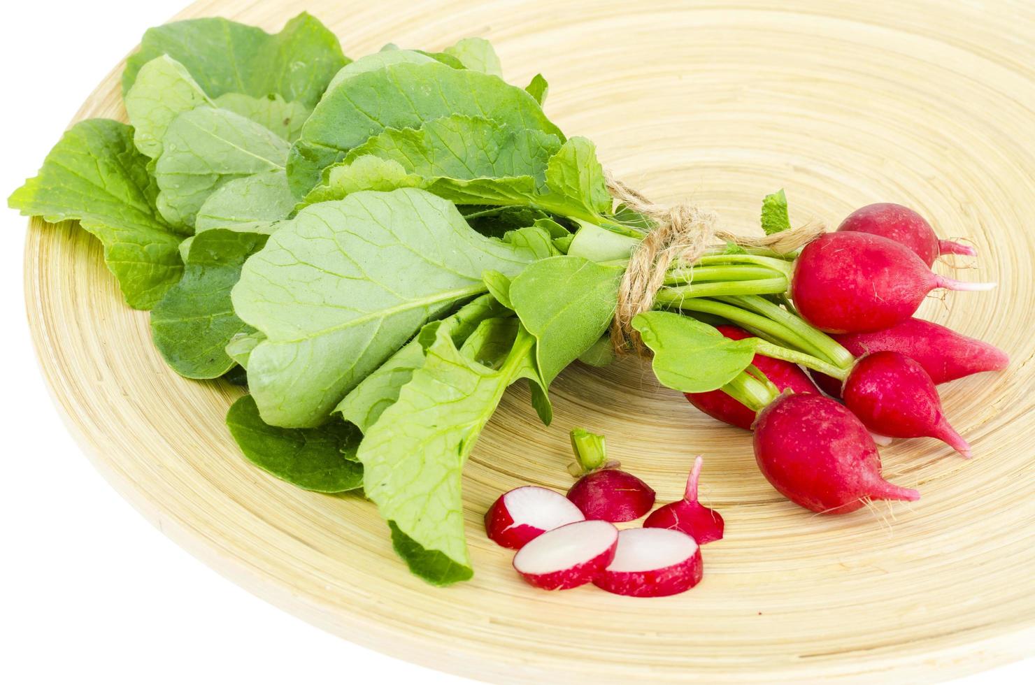 Fresh farmer bio radish on wooden plate. photo