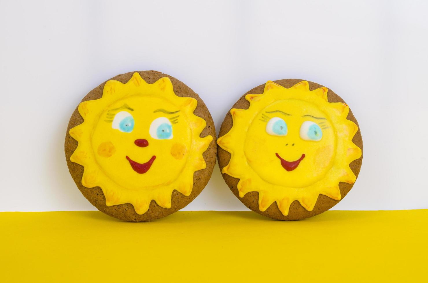 Two homemade gingerbread, cookies in shape of sun. Friendship day celebration concept photo