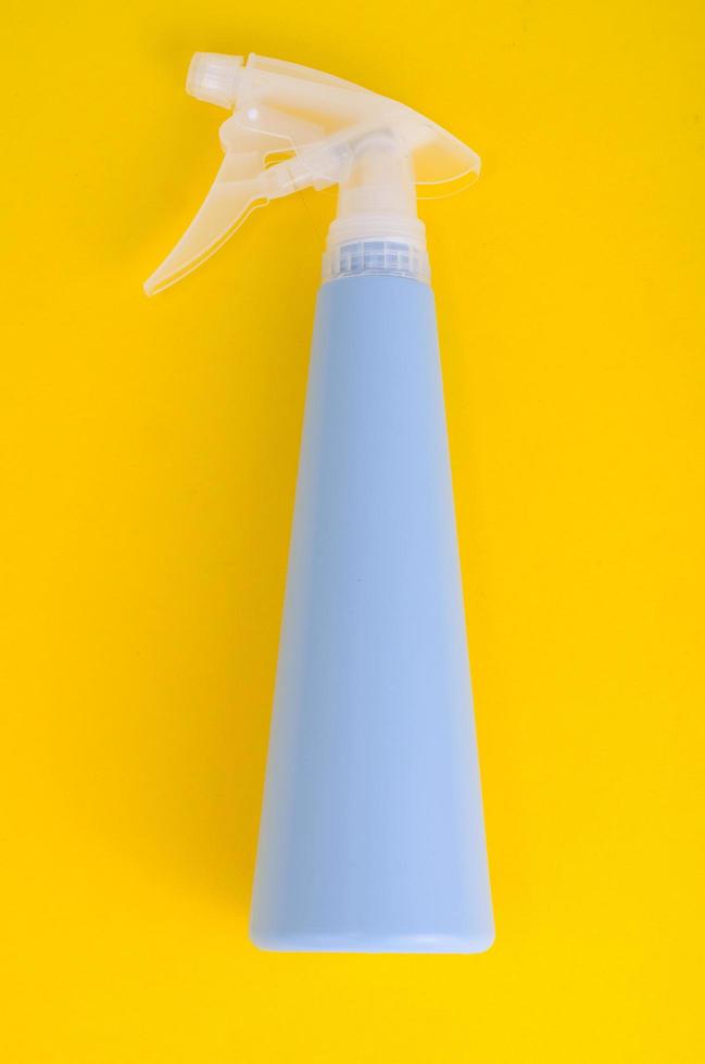 Blue bottle spray on bright background photo