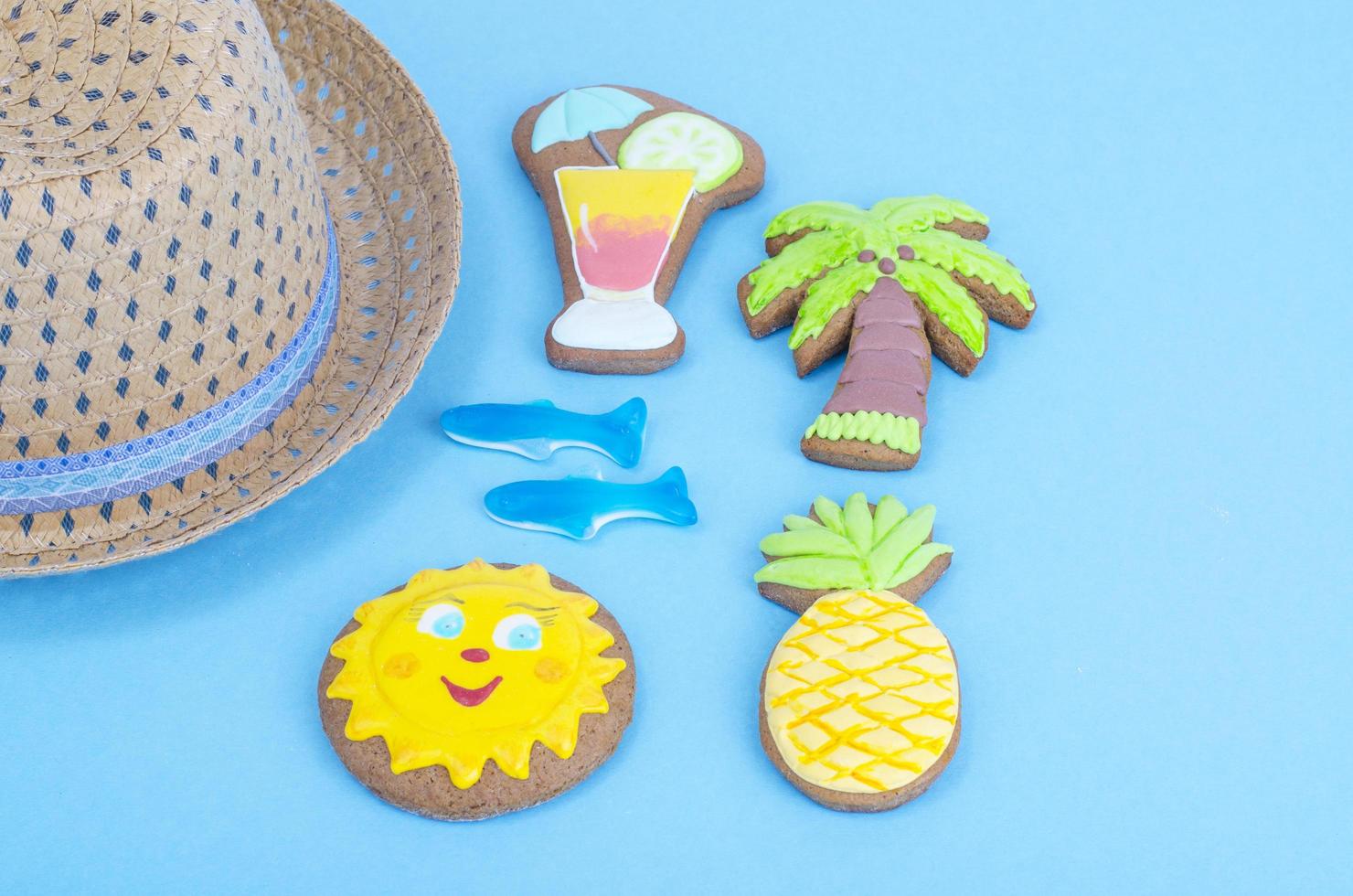 Homemade cookies with summer theme on blue background. photo