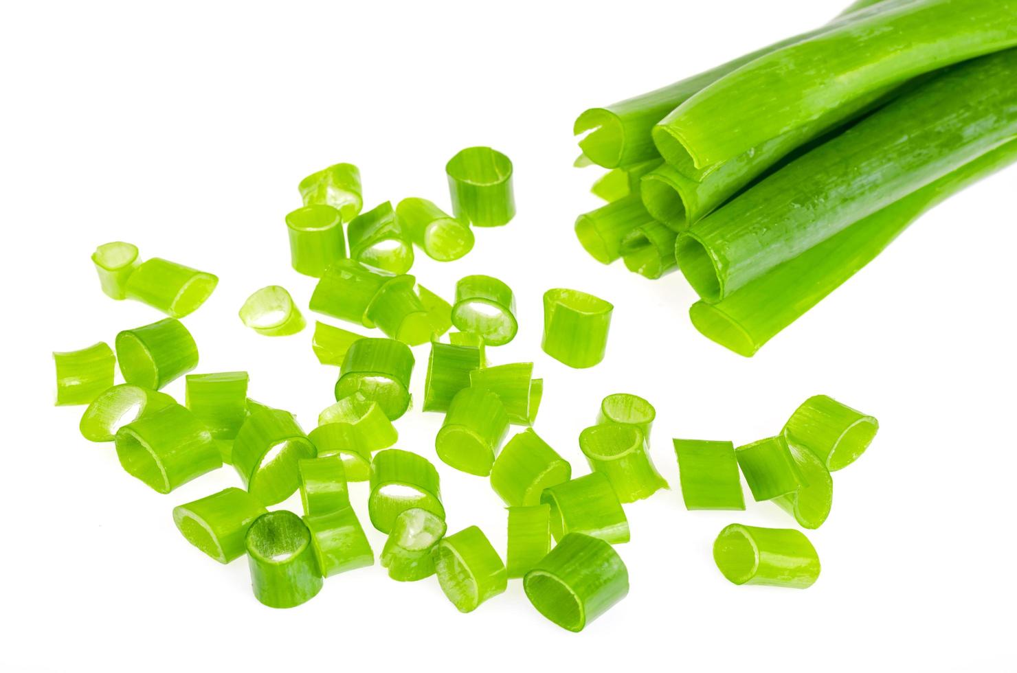 Fresh green onions on white background. Photo
