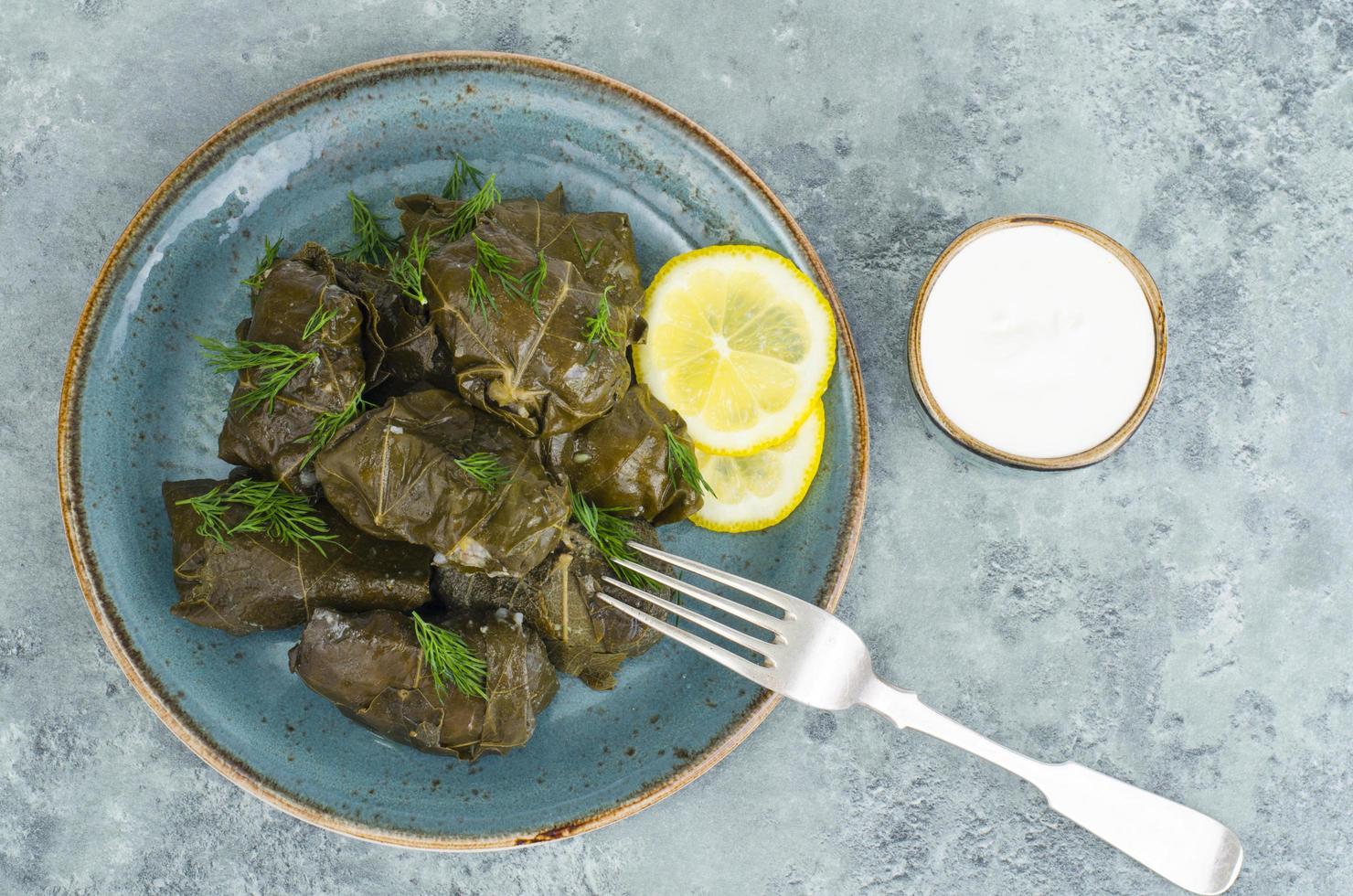 Dolma with meat, rice in grape leaves. photo