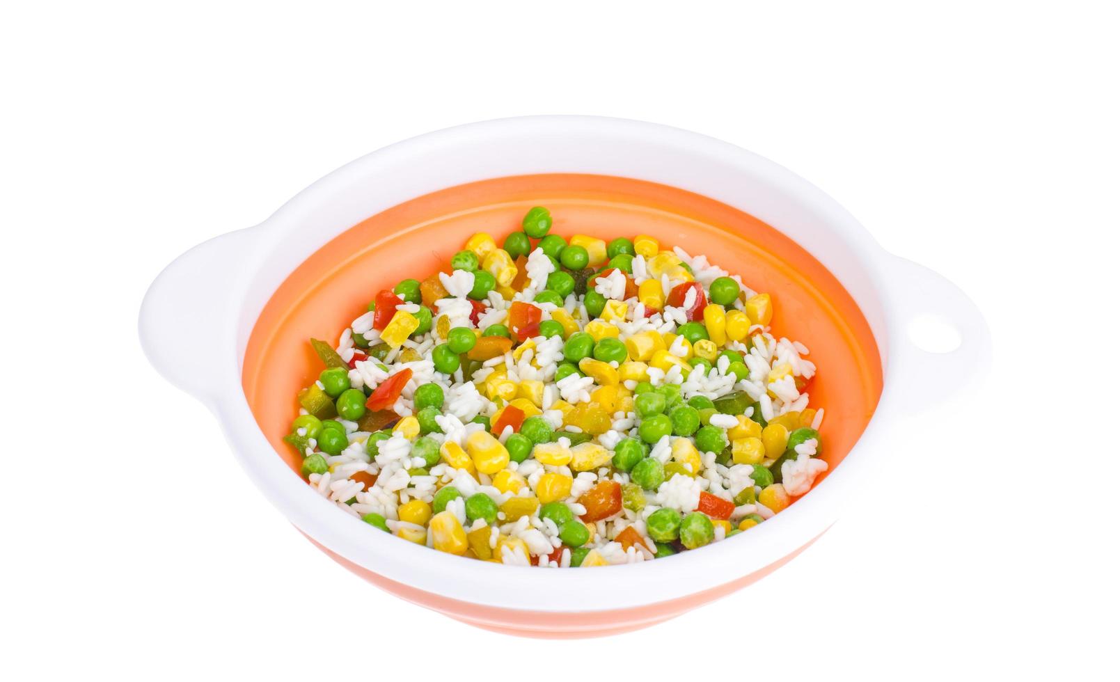 Frozen vegetables with rice isolated on white background photo