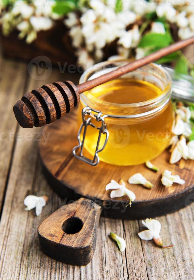 Honey with acacia blossoms photo