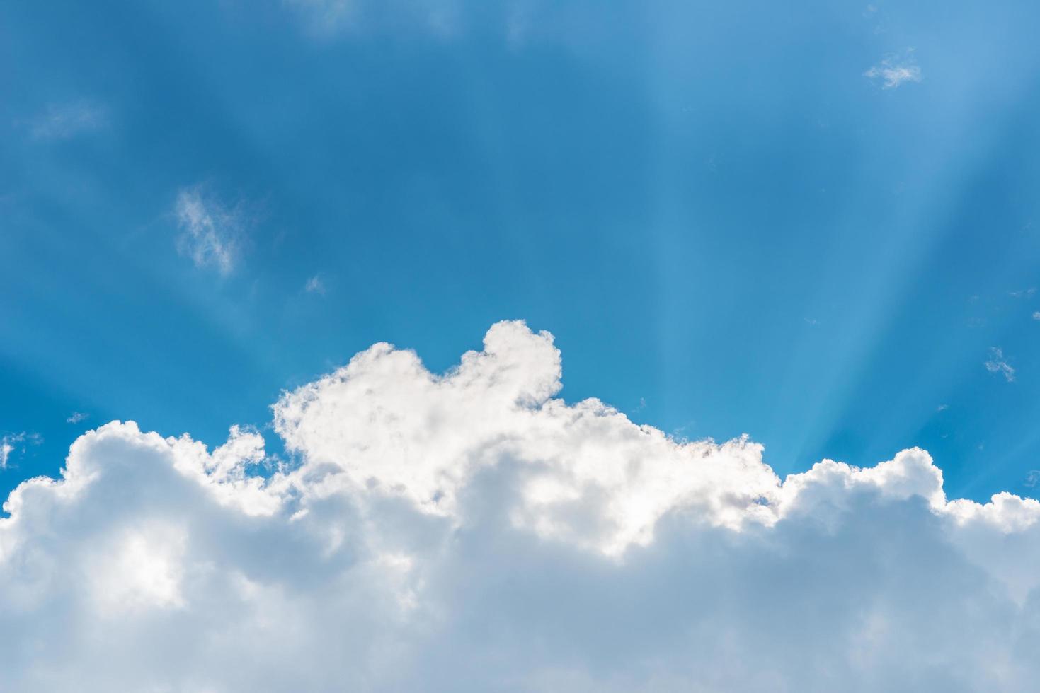 Beautiful blue sky and clouds. Sun rays photo