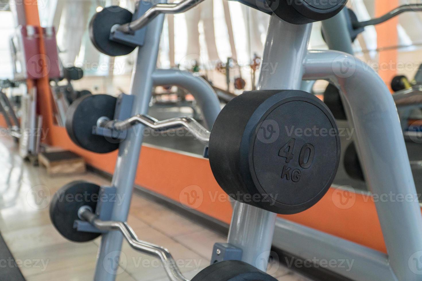 sports equipment and barbells in the gym photo