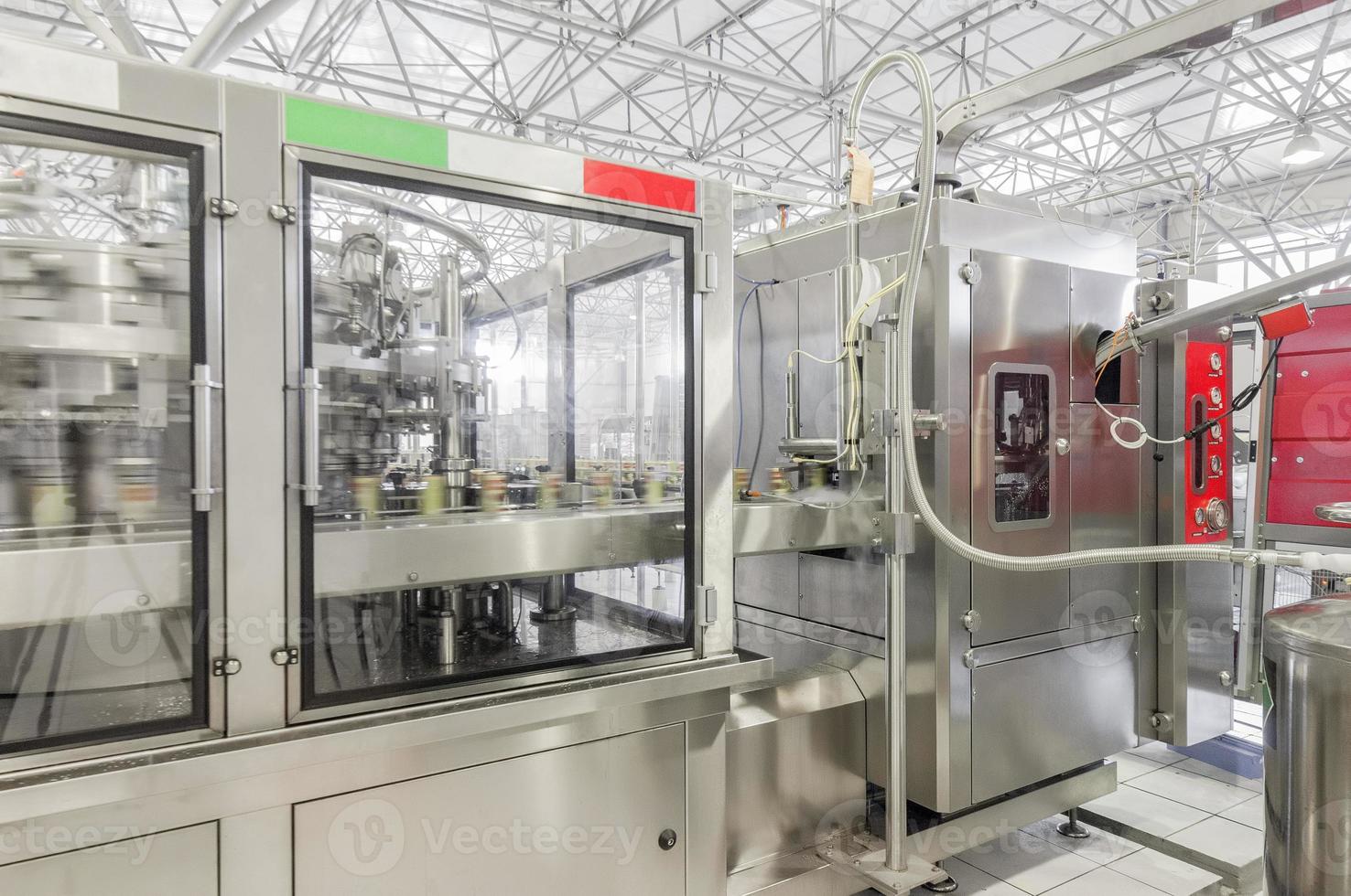 production and bottling of drinks in tin cans. production and bottling of drinks in tin cans photo