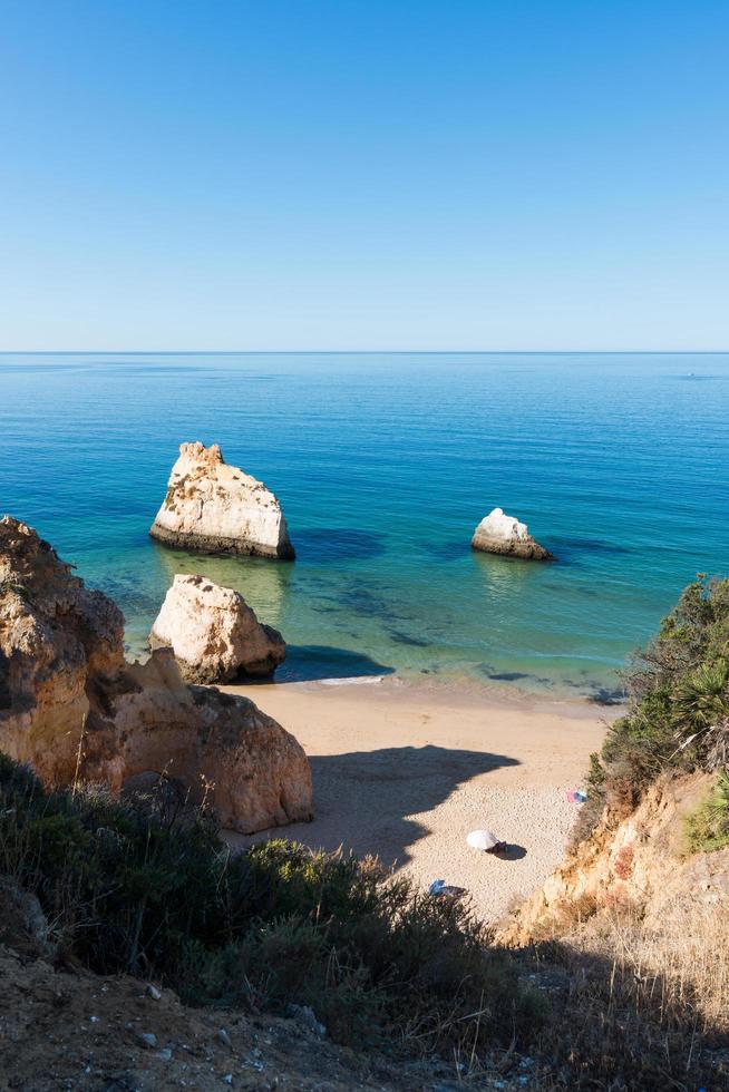 Aerial view of a beautiful beach in a sunny day. Three Brothers, Algarve, Portugal photo
