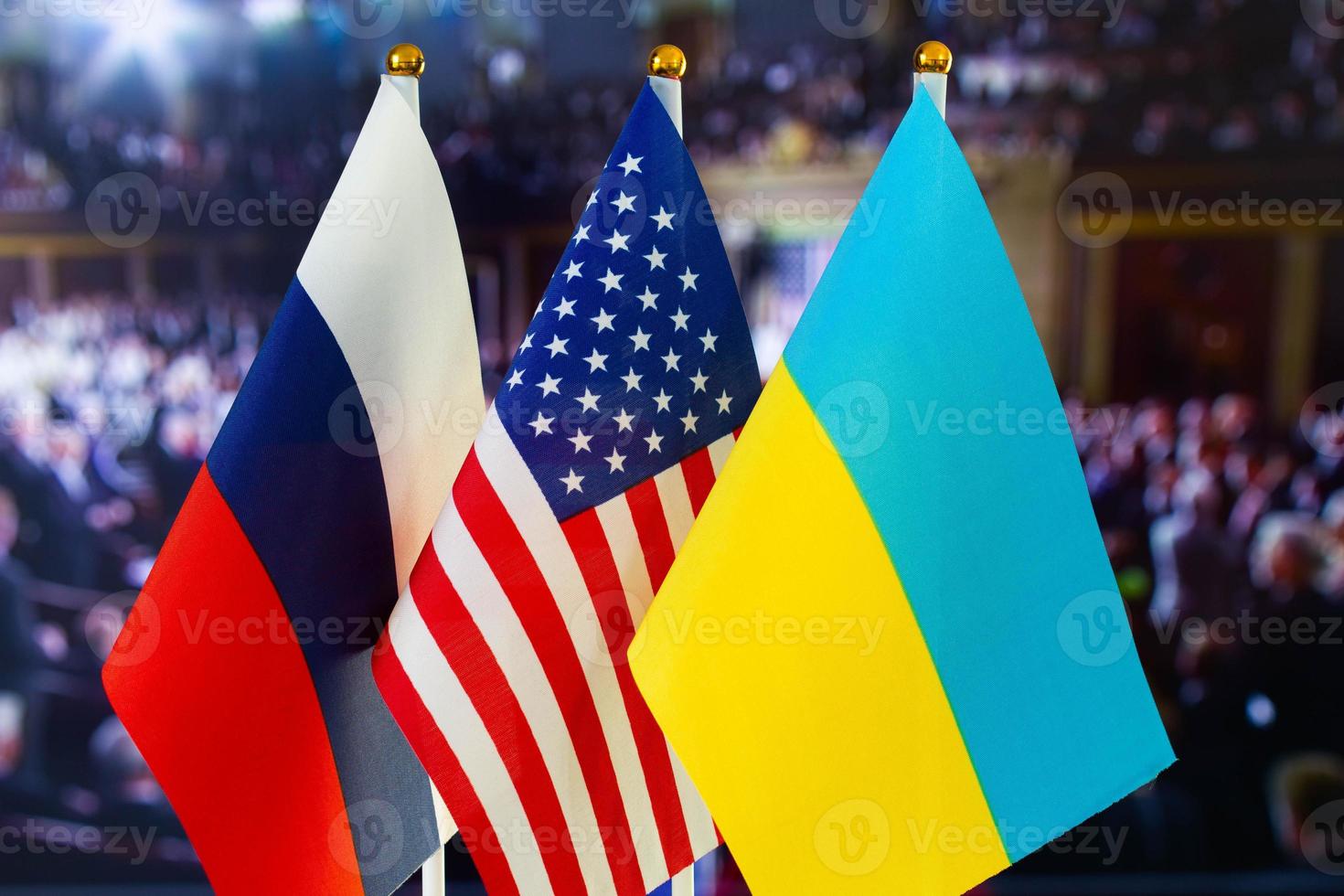The US flag, Russian flag, Ukraine flag. Flag of USA, flag of Russia, flag of Ukraine. The United States of America and the Russian Federation confrontation. Russia's invasion of Ukraine photo