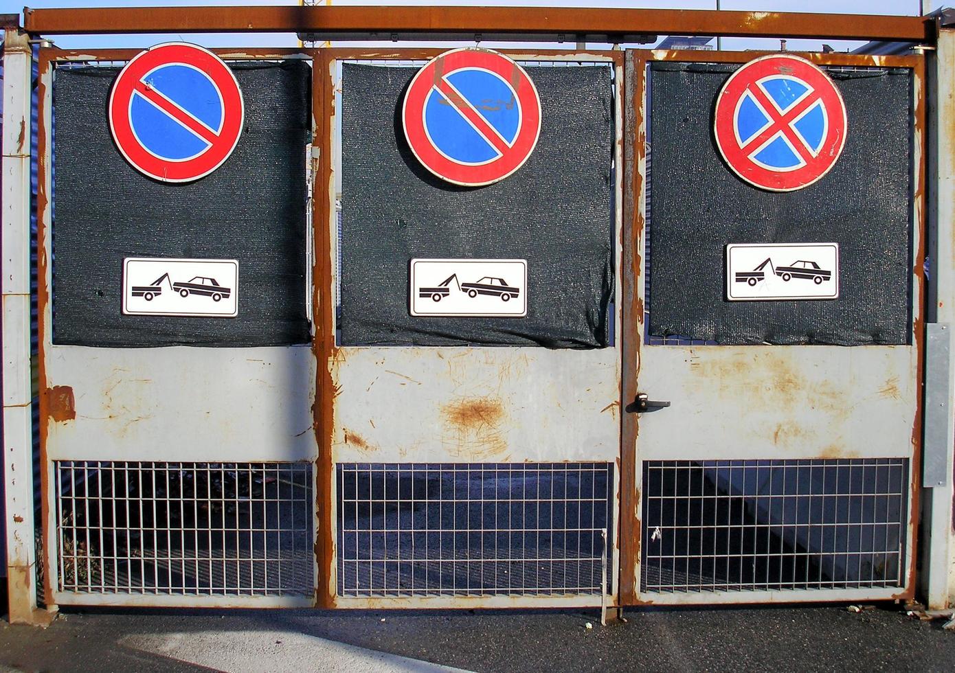 Fence with no parking sign photo