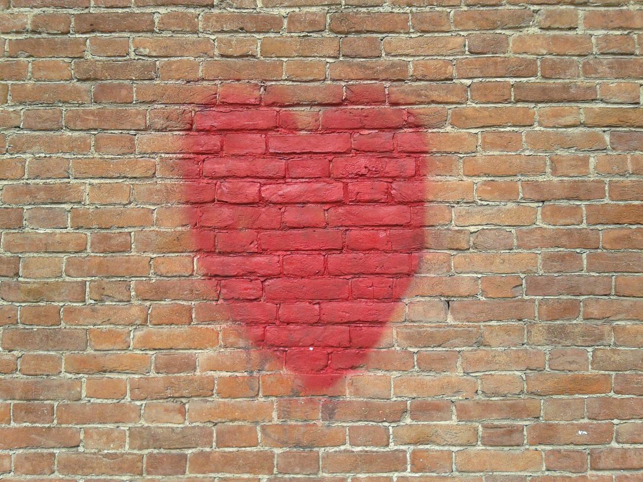 red heart on wall with copy space photo