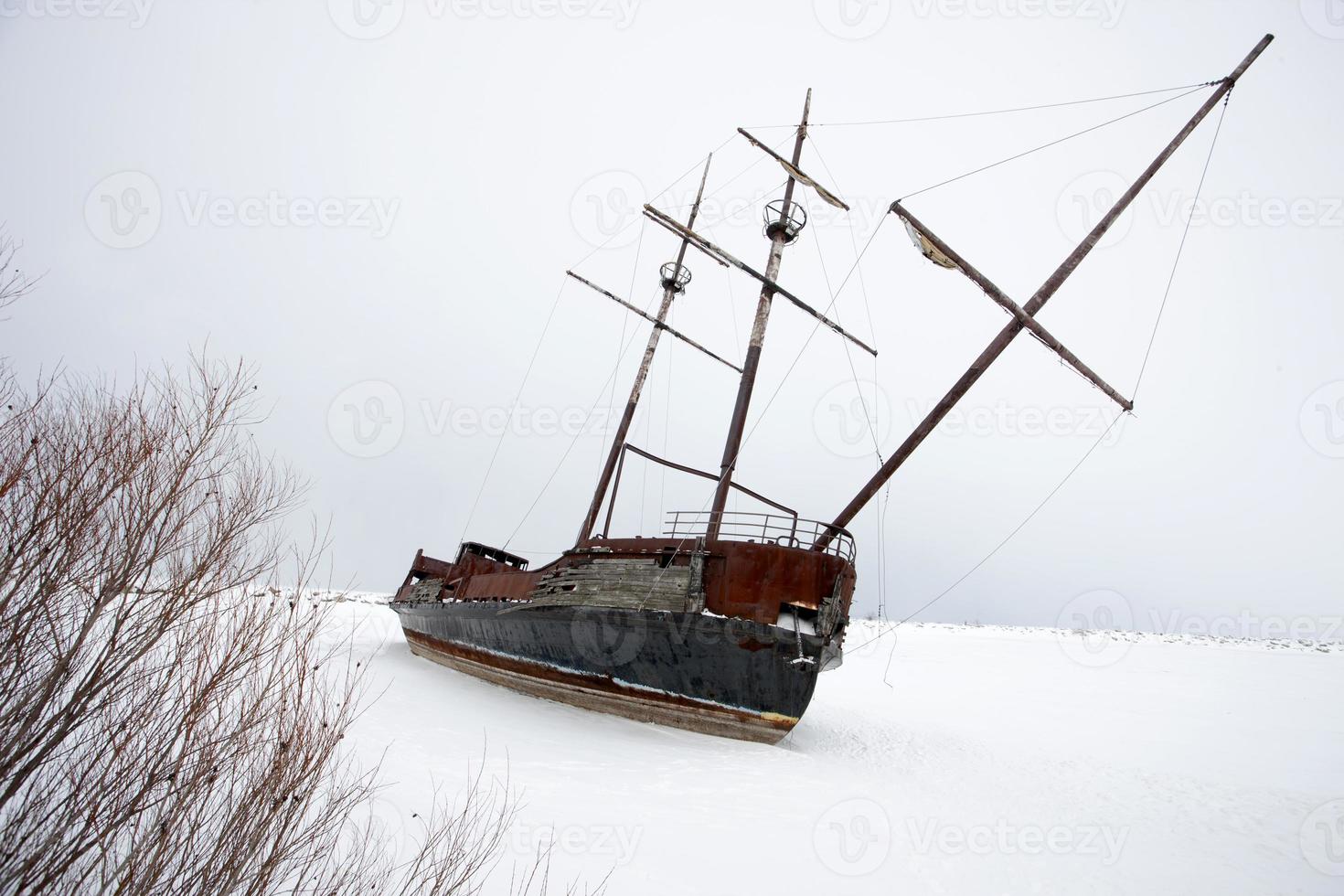 Old Abandoned rusty Sailboat photo