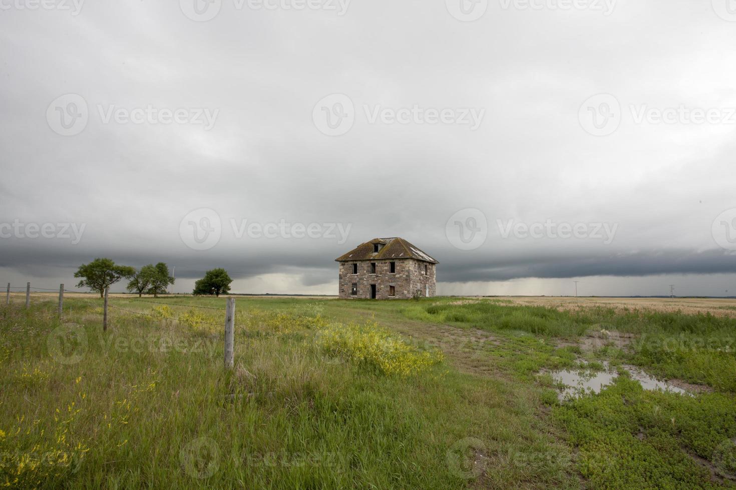 Storm Clouds Prairie Sky stone house photo