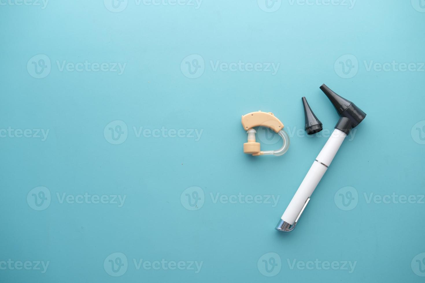 Hearing aid equipment on light green background photo