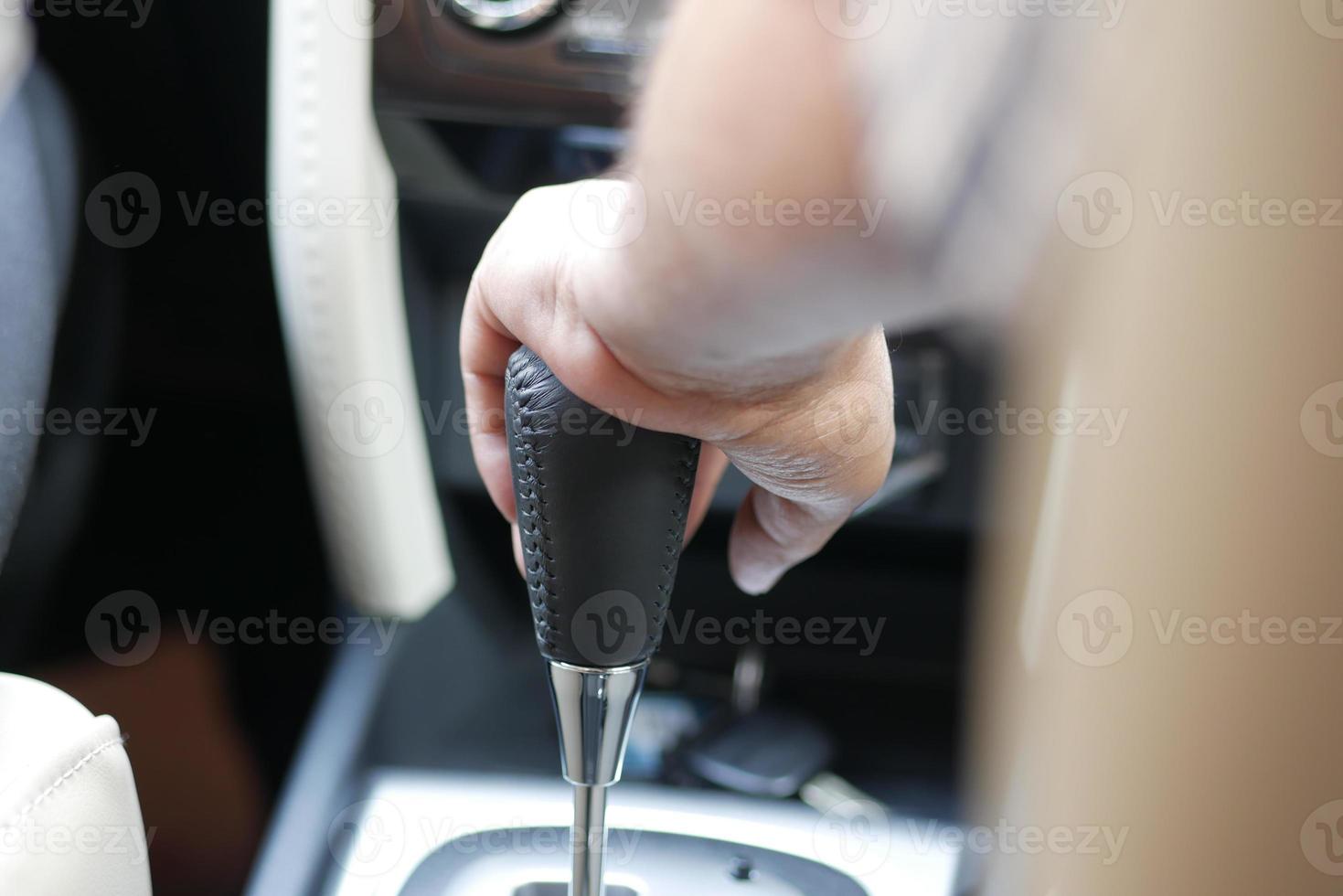 Male hand changing gear in the car, photo