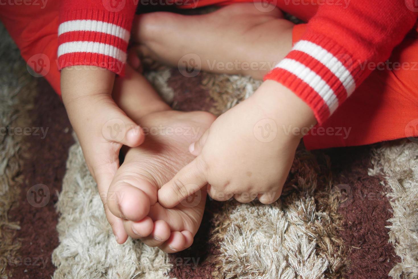 child girl suffering from itching skin, close up. photo
