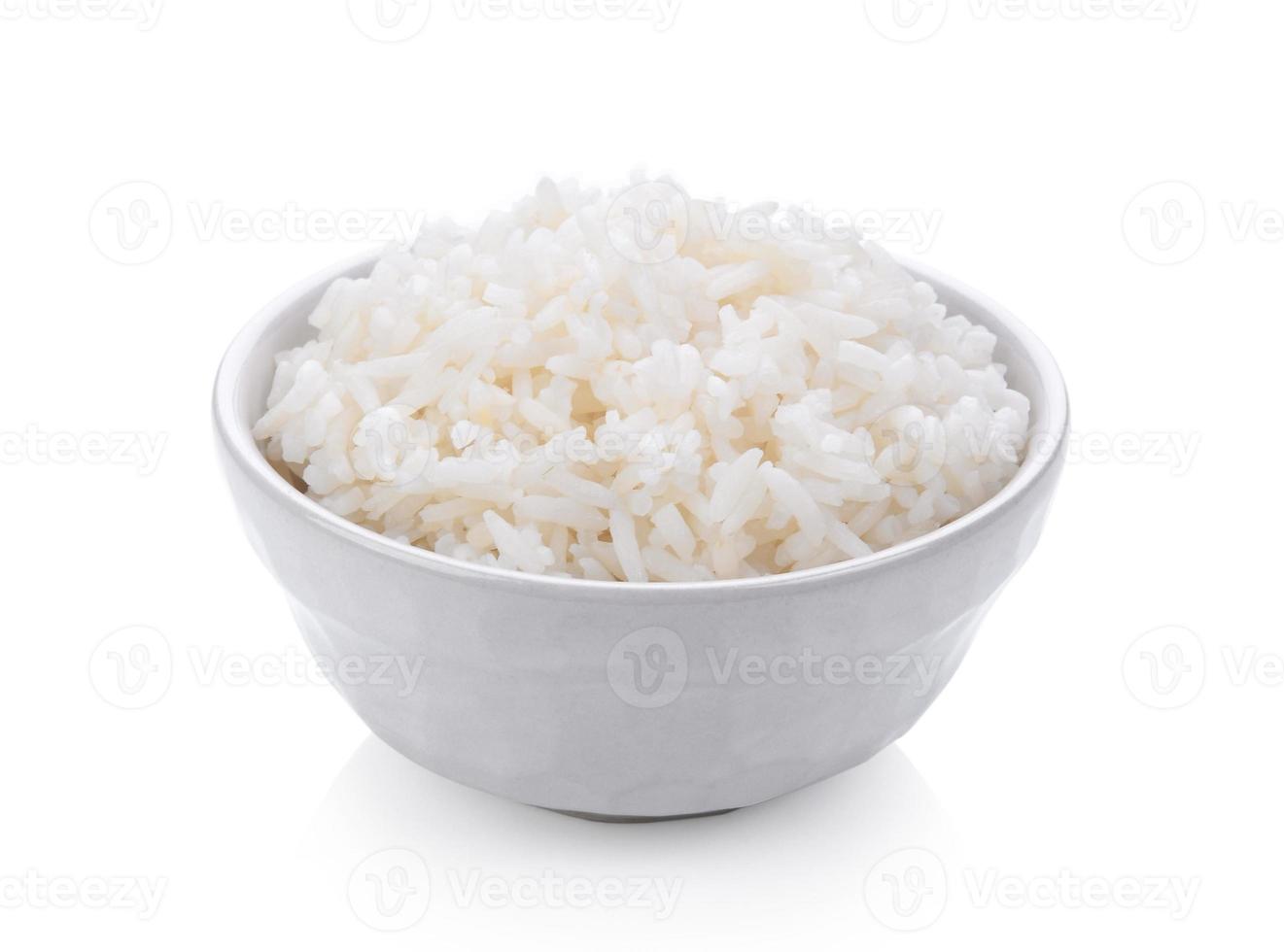 Rice in a bowl on white background photo