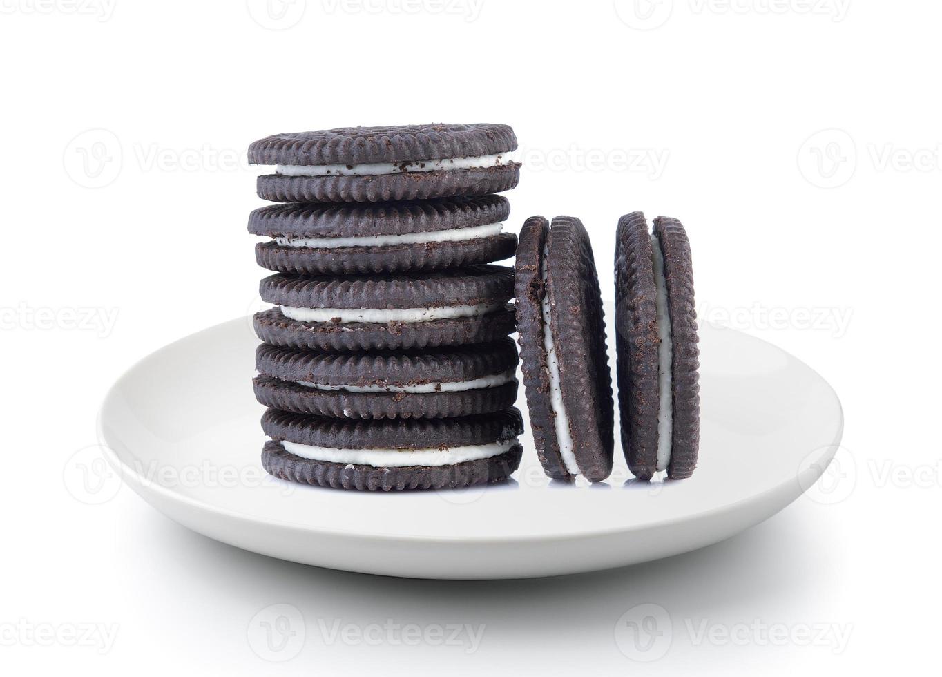 sandwich cookies with cream in a plate isolated on a white background photo