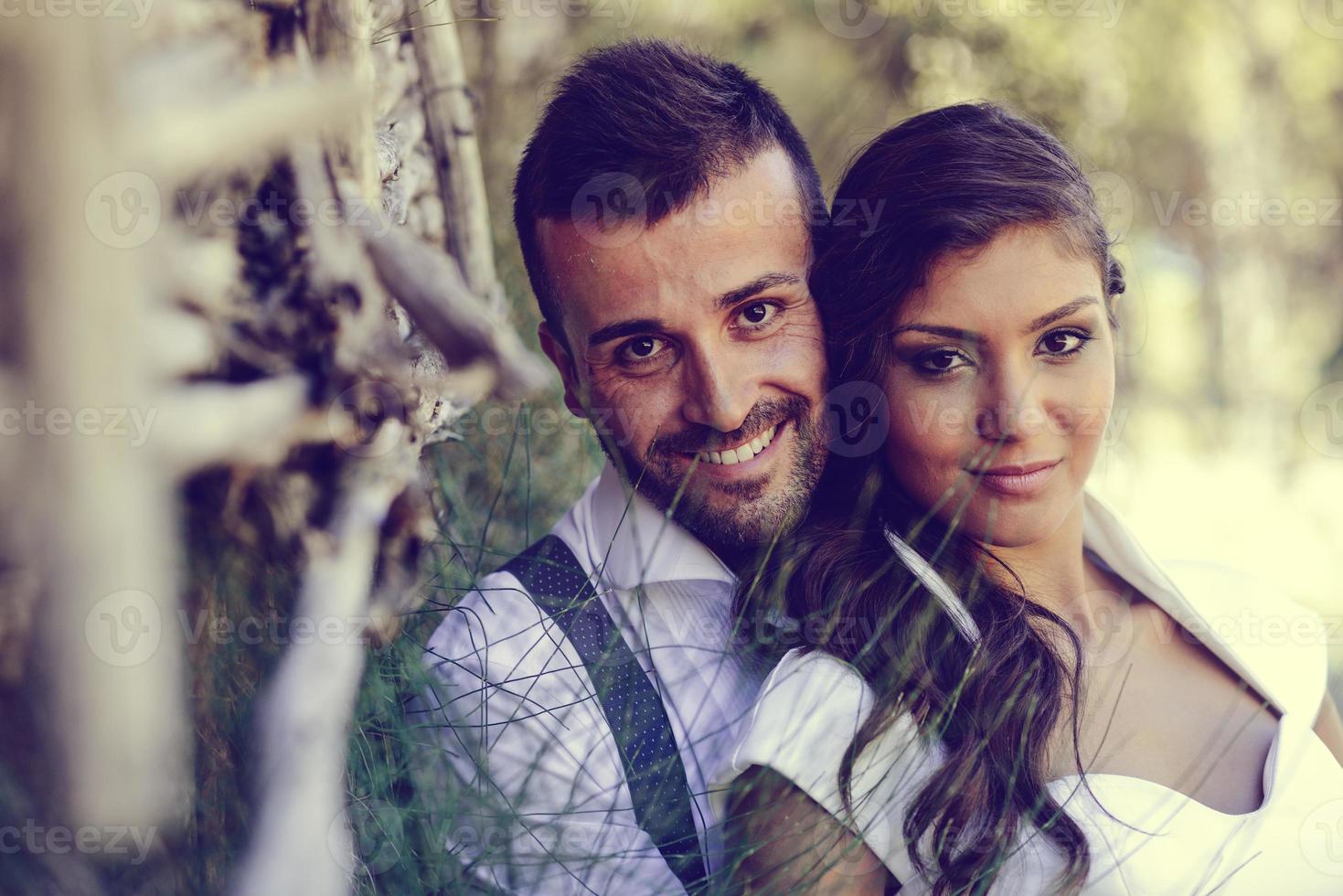 Just married couple in nature background photo