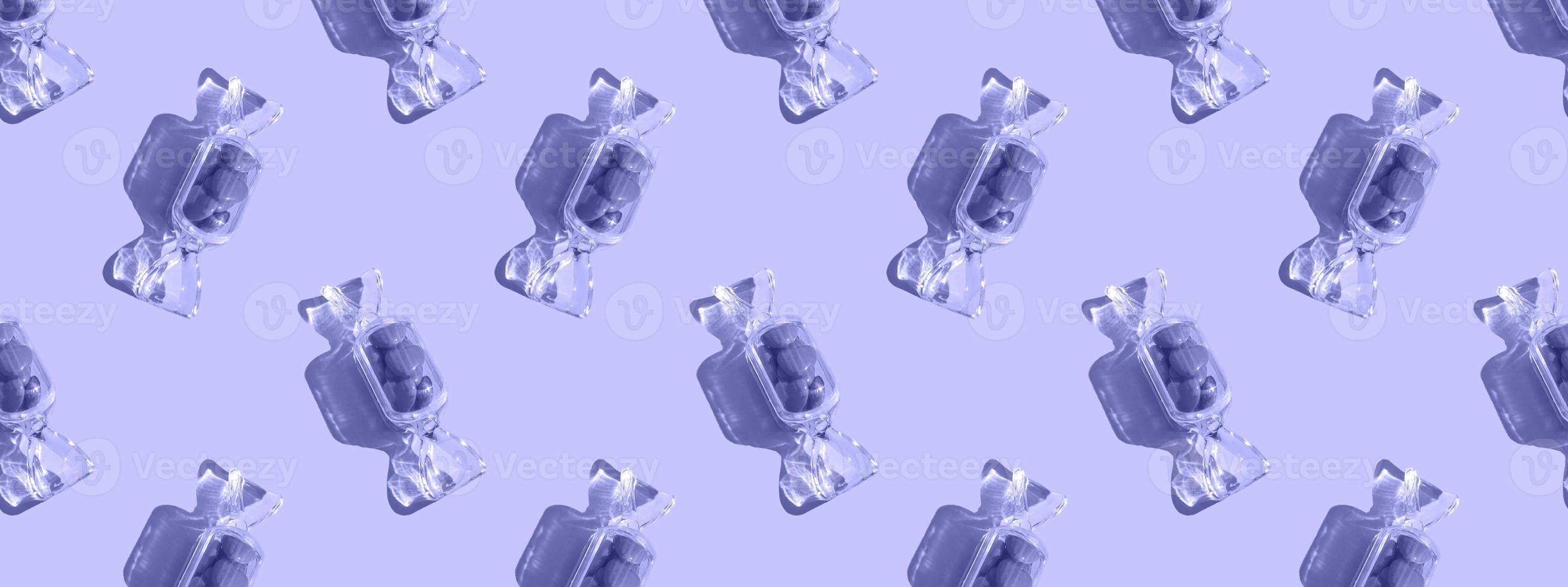 Transparent candy shaped box with sweet heart lollipops with hard shadow on pink background copy space. The concept of Valentines day, mothers day. Banner. pattern photo