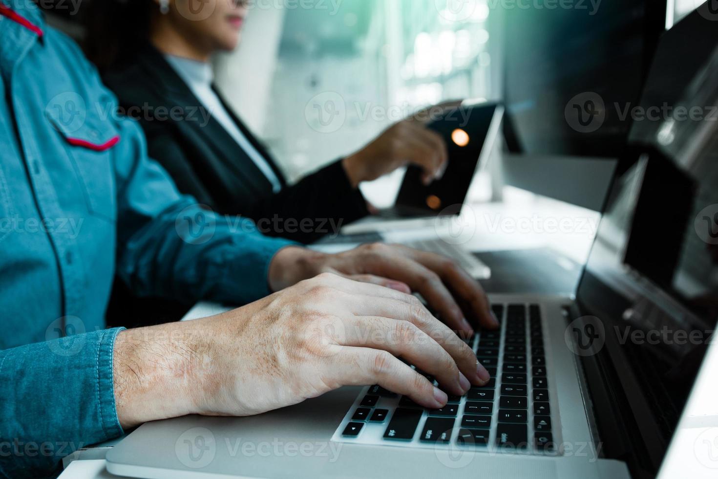 Developing programming and coding technologies working in a software engineers developing applications together in office. photo