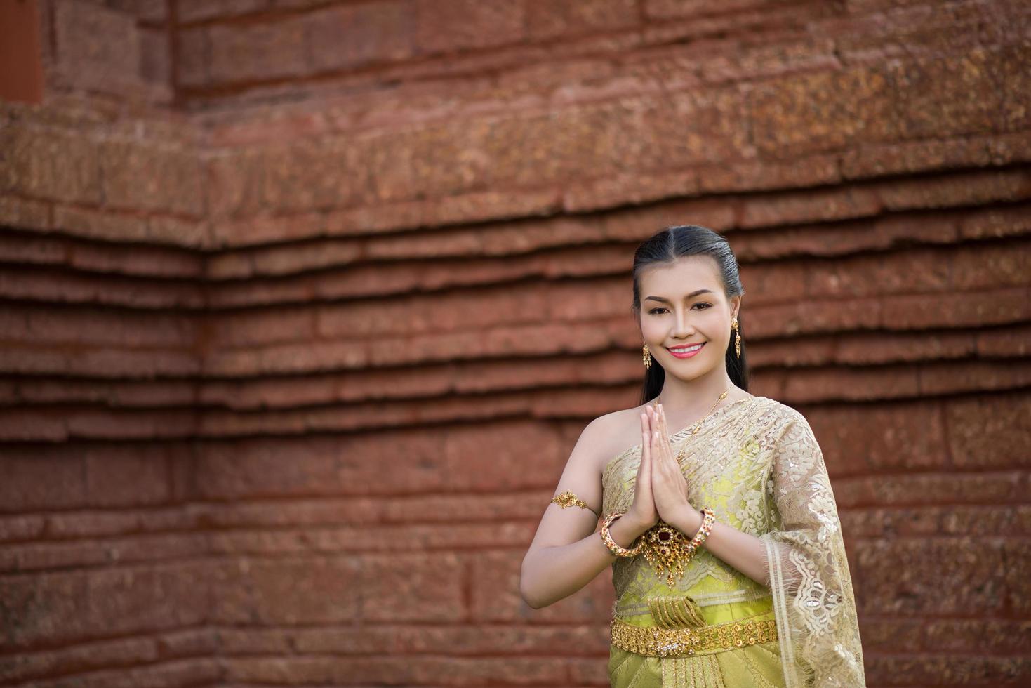 Beautiful Woman wearing typical Thai dress 5450706 Stock Photo at Vecteezy